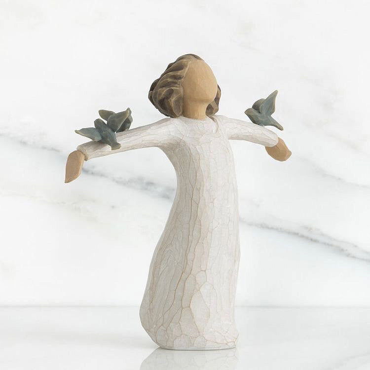 Little girl with birds figurine